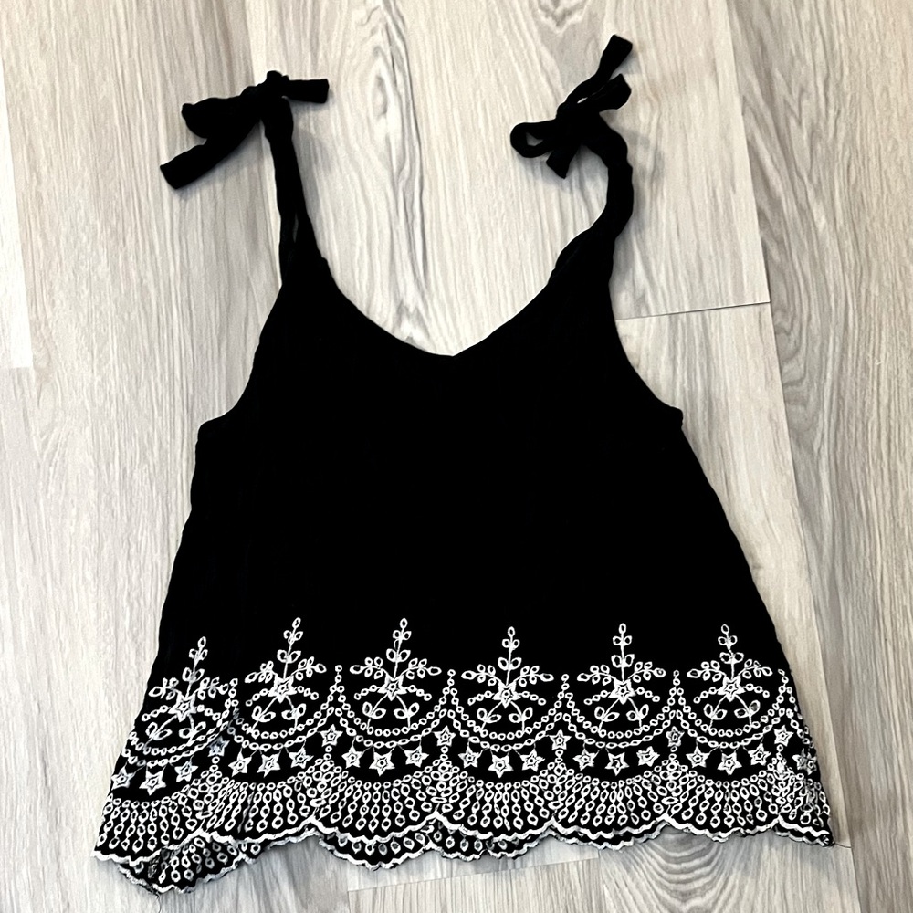 Black tank with tie straps, white lace detail